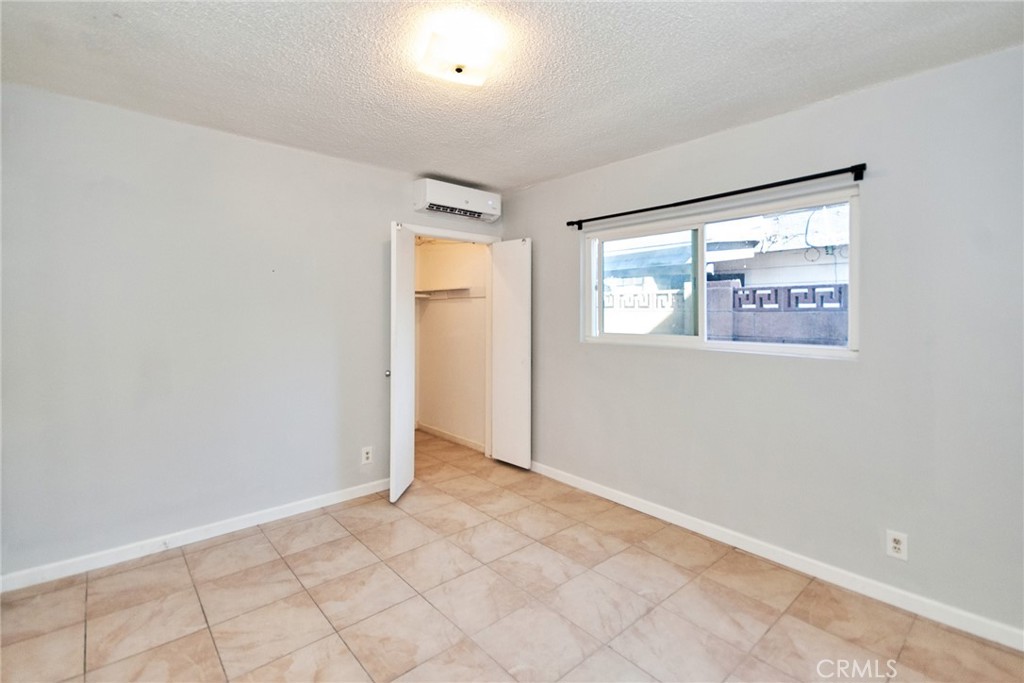 9510 1/2 Beverly Street Bellflower, CA 90706 - Photo 10 of 30 an empty room with windows