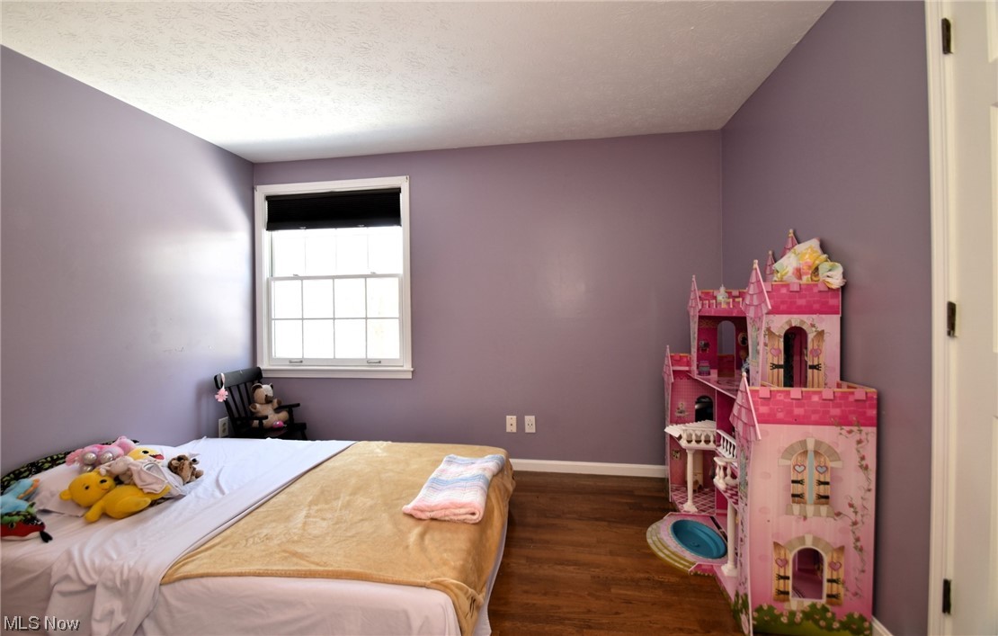 11801 Heath Road Chesterland, OH 44026 - Photo 15 of 21 Bedroom with dark hardwood floors