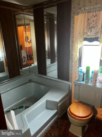 a bathroom with a toilet and a sink