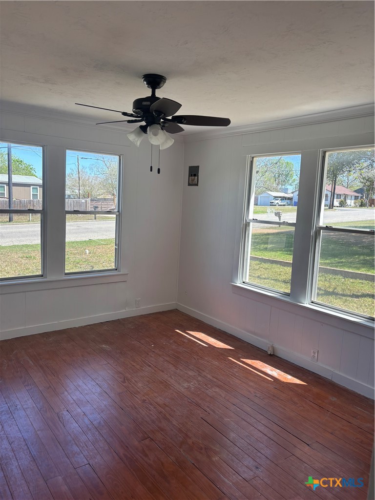 308 Poth Street Yoakum, TX 77995 - Photo 12 of 13 a view of an empty room with wooden floor and a window