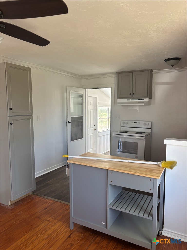308 Poth Street Yoakum, TX 77995 - Photo 5 of 13 a kitchen with stainless steel appliances a stove and a refrigerator