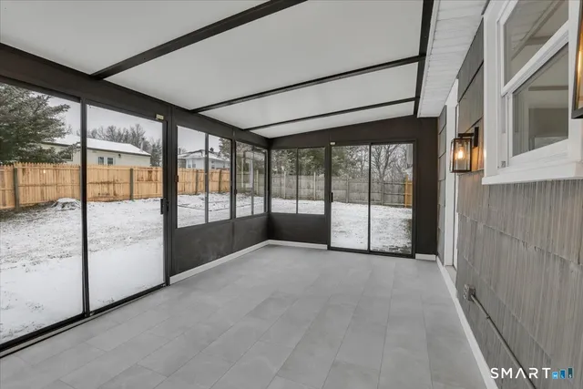 a view of an empty room with a sliding door