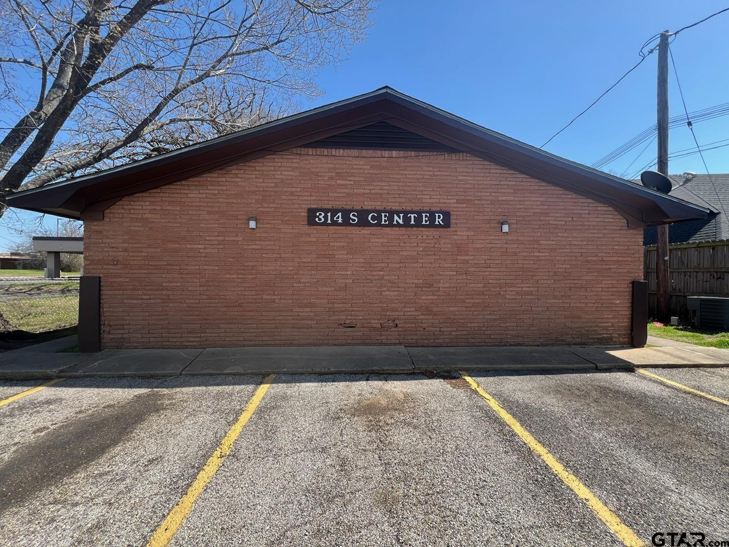 a black car parked in front of a building