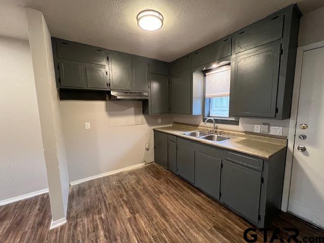 314 South Center Street Longview, TX 75601 - Photo 4 of 8 a bathroom with a sink and a mirror