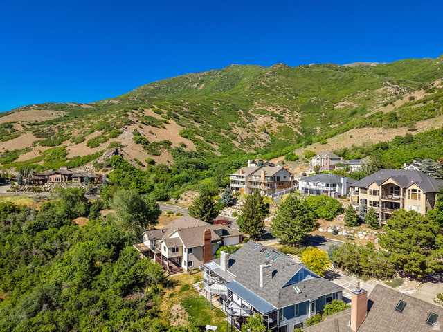 5057 South Ridgedale Drive Ogden, UT 84403 - Photo 62 of 69 Mountainous terrain surrounds a residential area with several multi-story homes