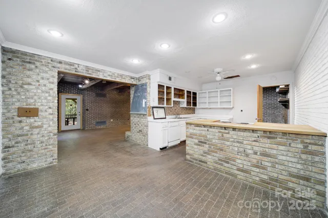 a kitchen with stainless steel appliances granite countertop a stove and a sink