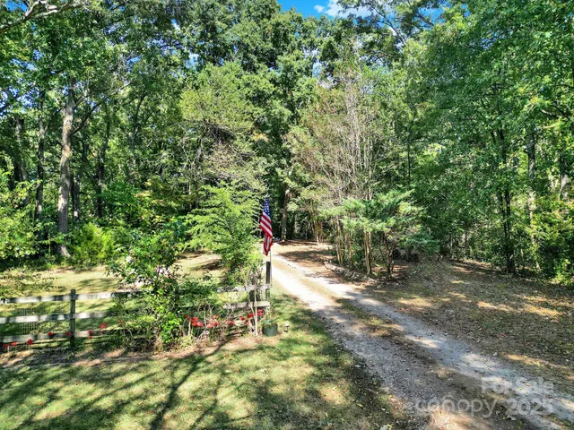 an aerial view of a houses with a yard