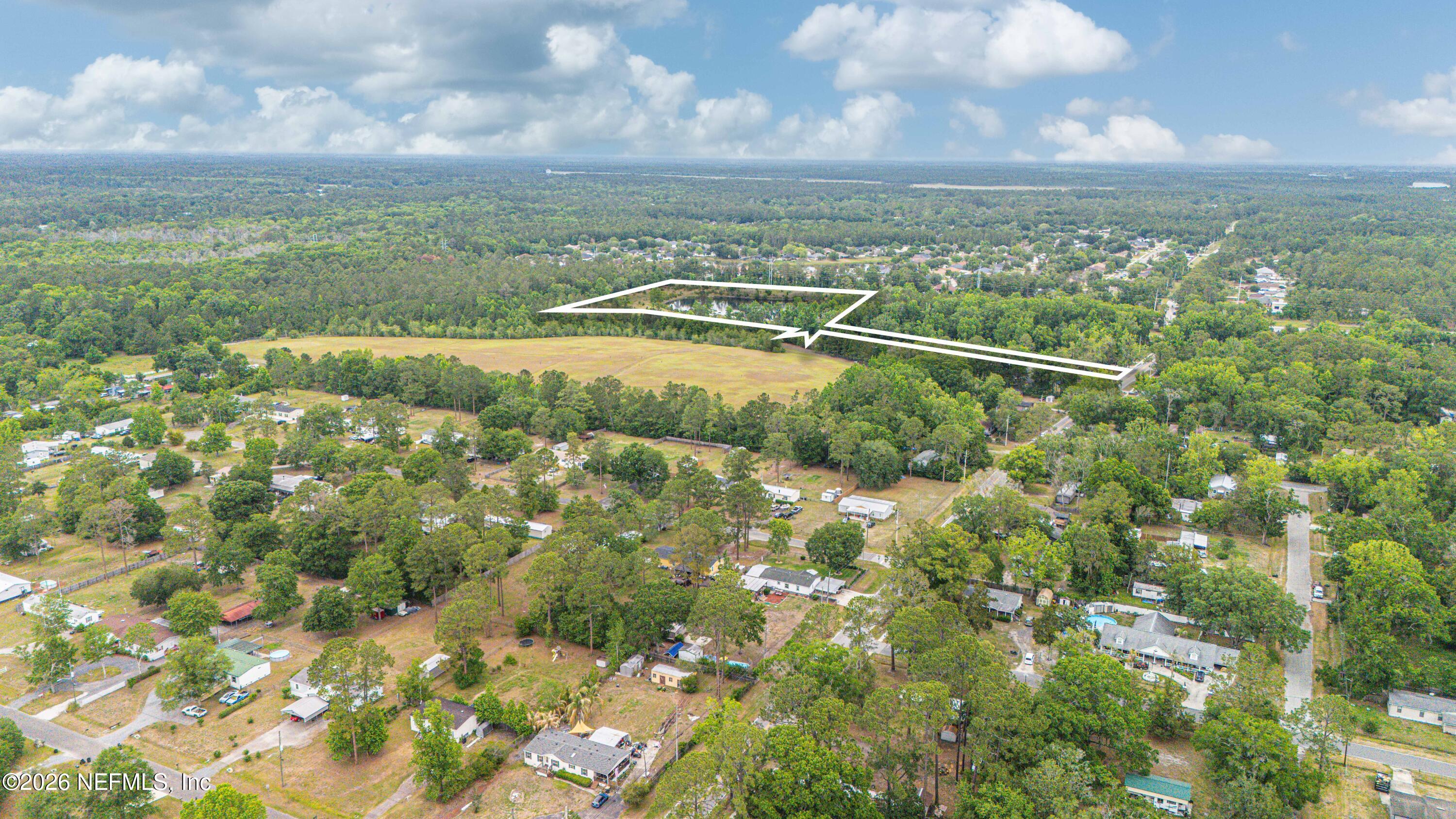 408 Chaffee Road North Jacksonville, FL 32220 - Photo 6 of 8 a view of a city with lots of trees