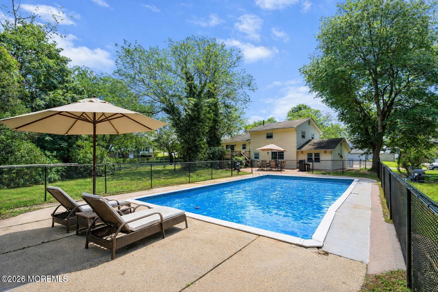 90 East Connecticut Concourse Jackson, NJ 08527 - Photo 13 of 15 an outdoor sitting area with swimming pool and furniture