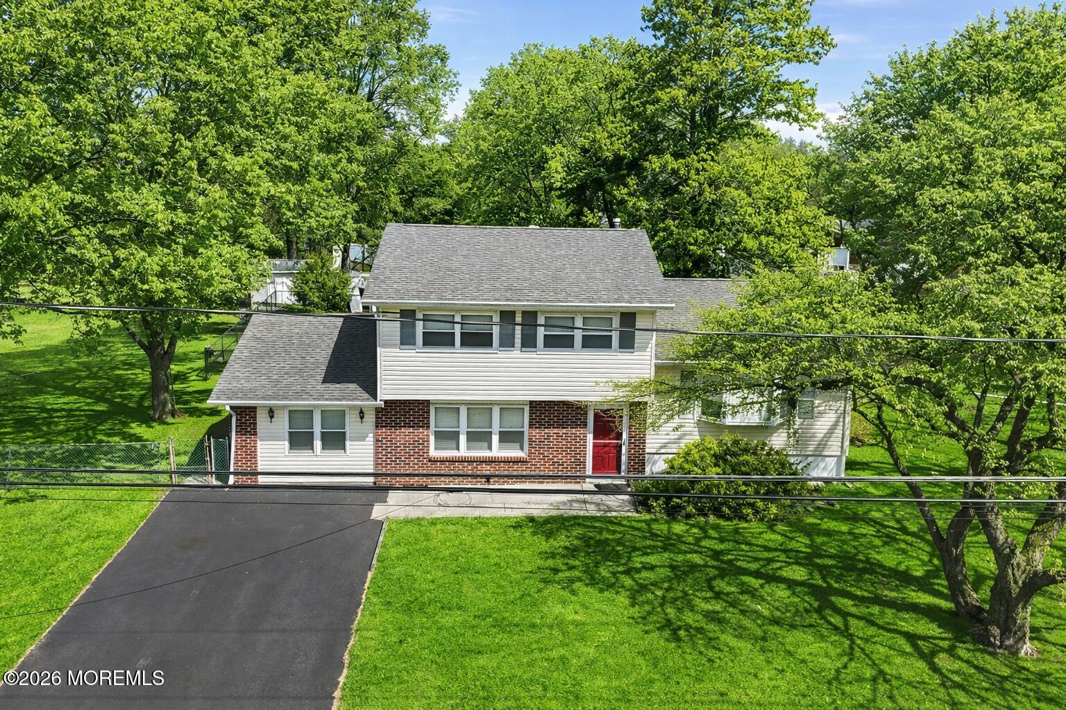 90 East Connecticut Concourse Jackson, NJ 08527 - Photo 3 of 15 a aerial view of a house with a yard table and chairs