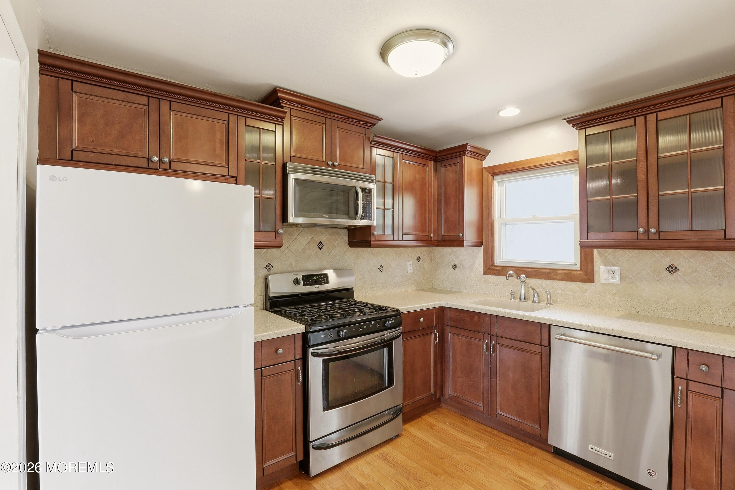 90 East Connecticut Concourse Jackson, NJ 08527 - Photo 6 of 15 a kitchen with stainless steel appliances granite countertop a refrigerator sink stove microwave and cabinets