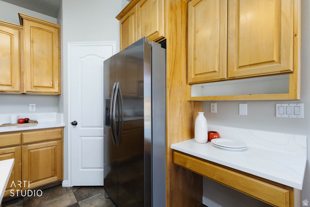 2158 Balboa Way St. George, UT 84770 - Photo 10 of 40 Kitchen featuring stainless steel fridge and light brown cabinetry