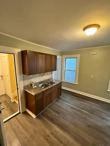 a kitchen with stainless steel appliances granite countertop a stove and a refrigerator