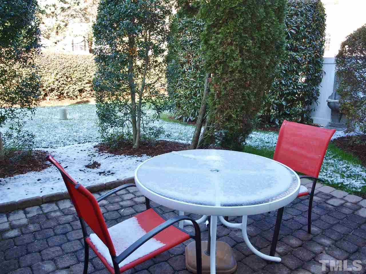 1402 Basinger Court Raleigh, NC 27612 - Photo 16 of 16 a balcony with a table and chairs