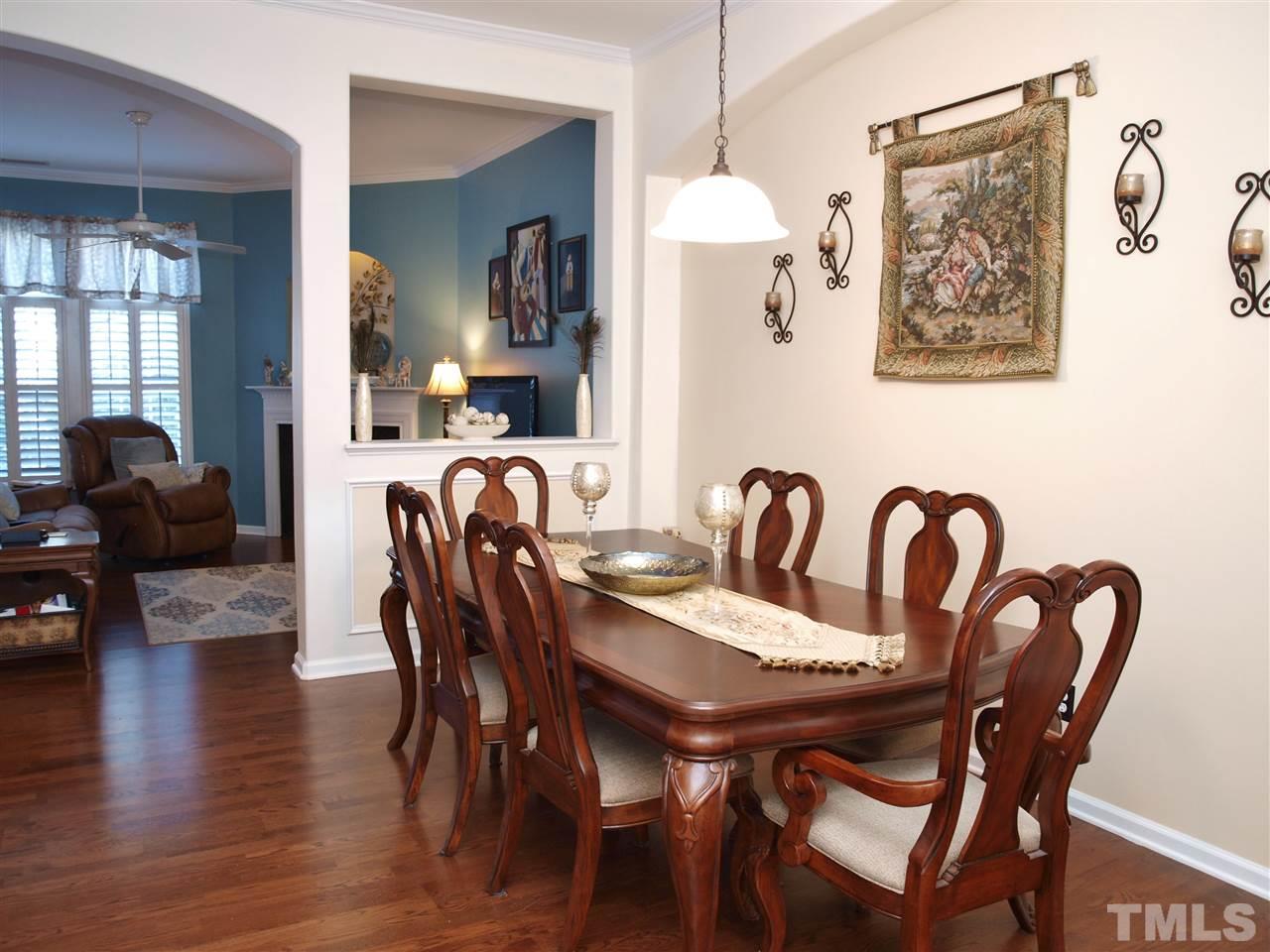 1402 Basinger Court Raleigh, NC 27612 - Photo 3 of 16 a view of a a dining room with furniture window and wooden floor