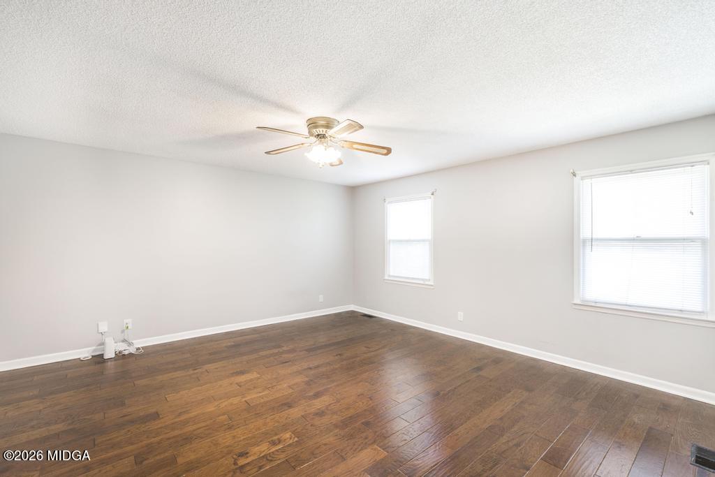 3710 Sandy Circle Macon, GA 31216 - Photo 23 of 44 an empty room with wooden floor and window