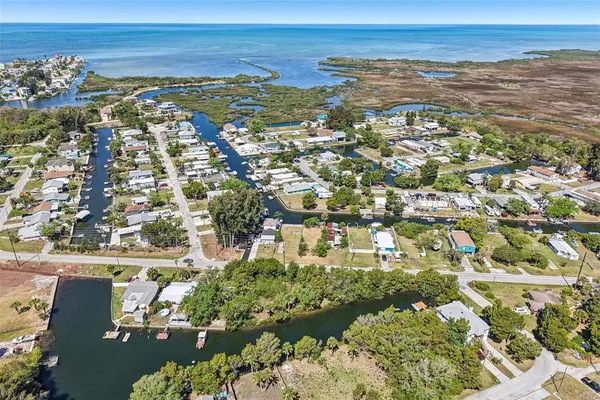 an aerial view of residential building and lake