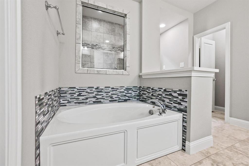 3500 Jersey Road Melissa, TX 75454 - Photo 17 of 40 a bathroom with a bathtub and a window