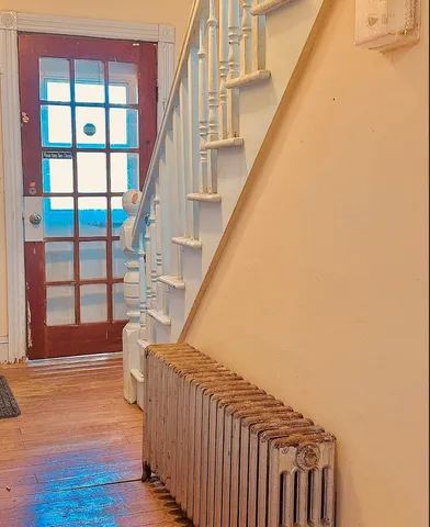 a view of entryway with wooden floor