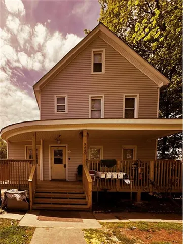 a front view of a house with stairs