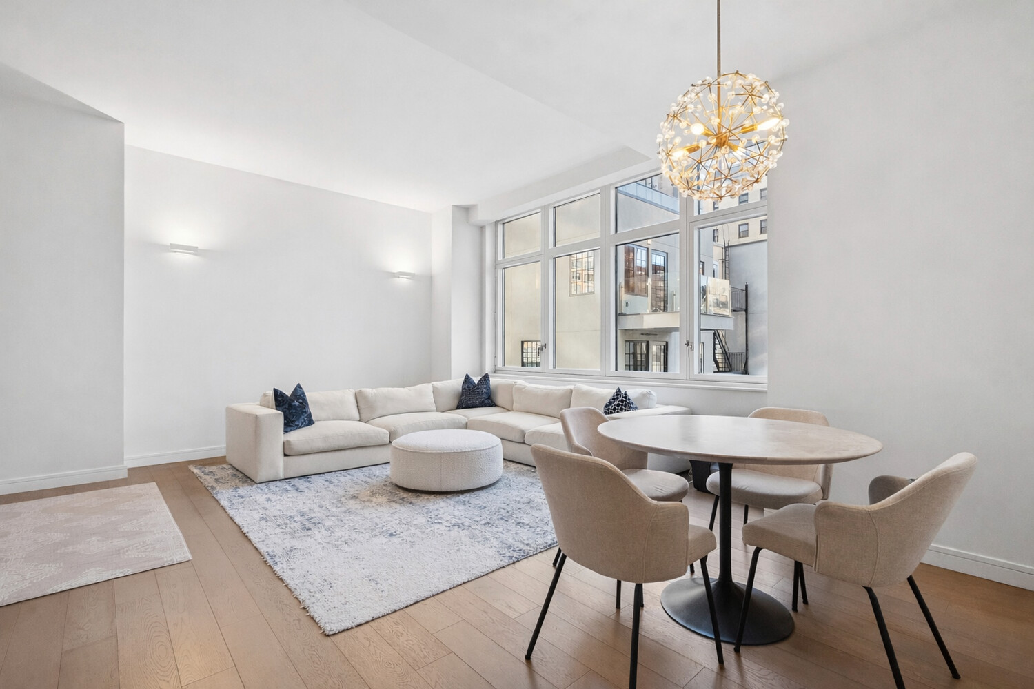 a view of a dining room with furniture and chandelier