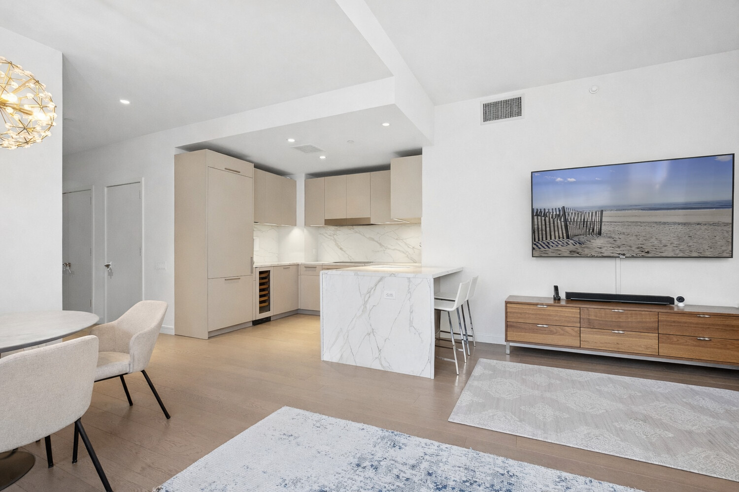 305 East 51st Street, Unit RU5F Manhattan, NY 10022 - Photo 2 of 13 a living room with stainless steel appliances kitchen island granite countertop furniture and a couch