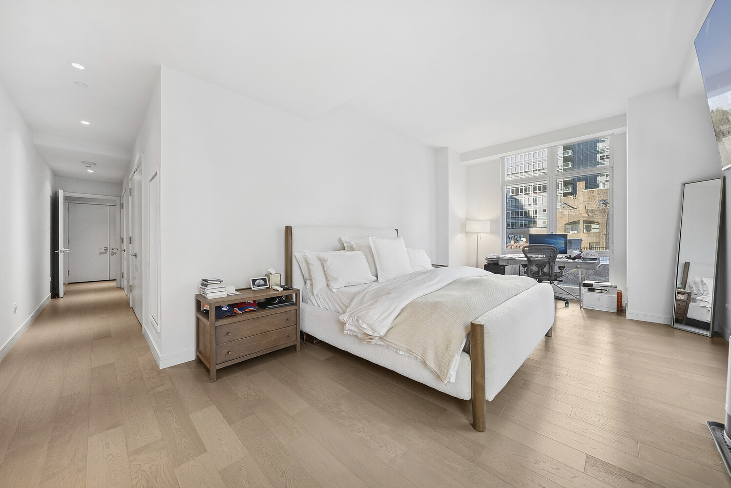 305 East 51st Street, Unit RU5F Manhattan, NY 10022 - Photo 4 of 13 a spacious bedroom with a bed and walk in closet