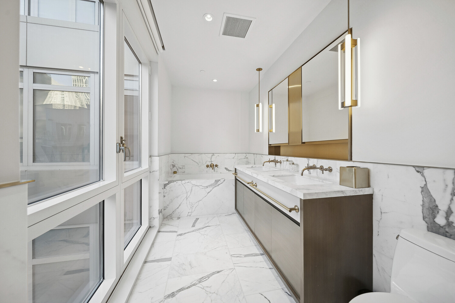 305 East 51st Street, Unit RU5F Manhattan, NY 10022 - Photo 6 of 13 a bathroom with a sink and a mirror