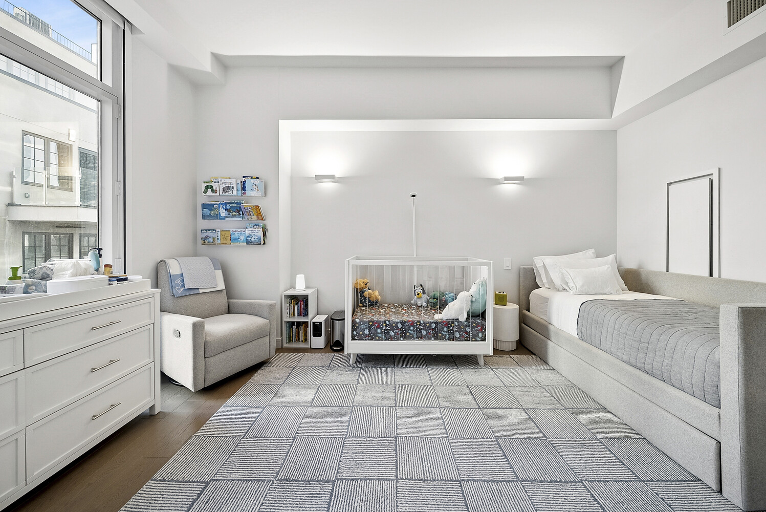 305 East 51st Street, Unit RU5F Manhattan, NY 10022 - Photo 8 of 13 a spacious bedroom with a bed and a couch