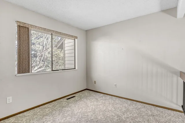 a view of empty room with windows