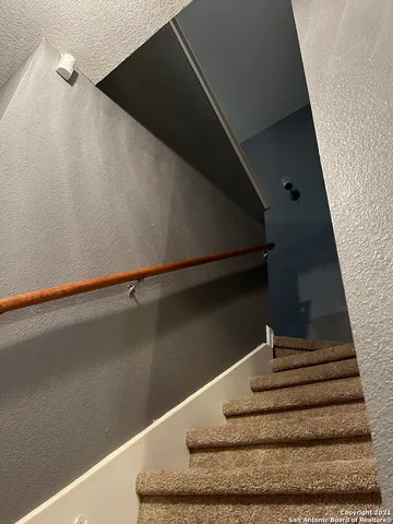 a room with furniture a lamp and a window