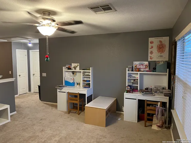 a view of a room with toys and wooden floor