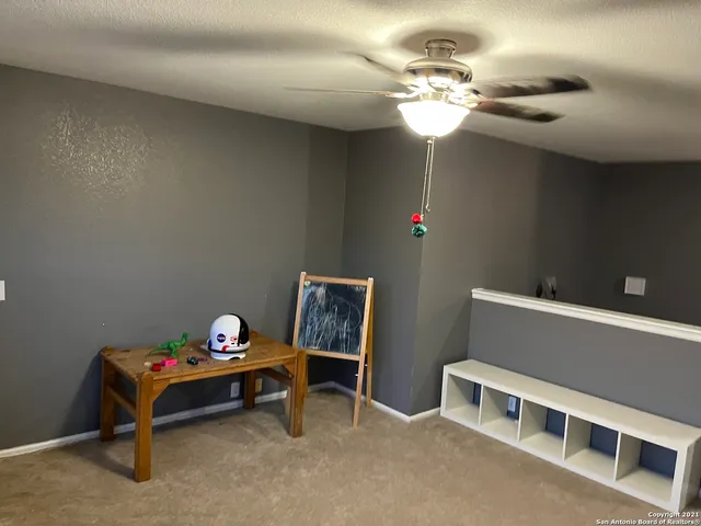 a bedroom with a bed and a tv