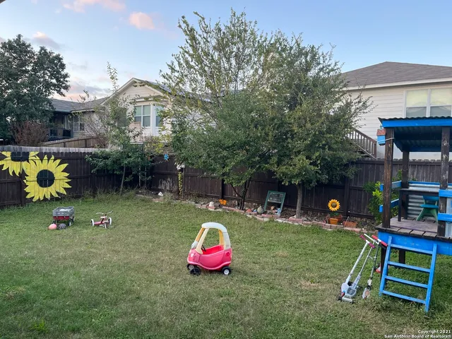 a childrens park with lots of swings and slides