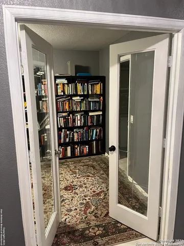 a view of a workspace with bookshelf