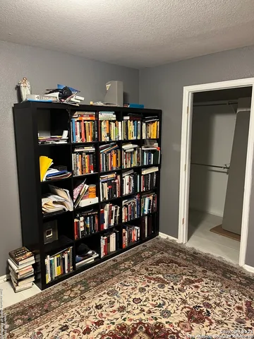 a bed room with furniture and a flat screen tv