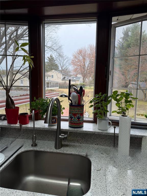249 Madison Avenue Cresskill, NJ 07626 - Photo 13 of 26 a kitchen with a sink and a large window