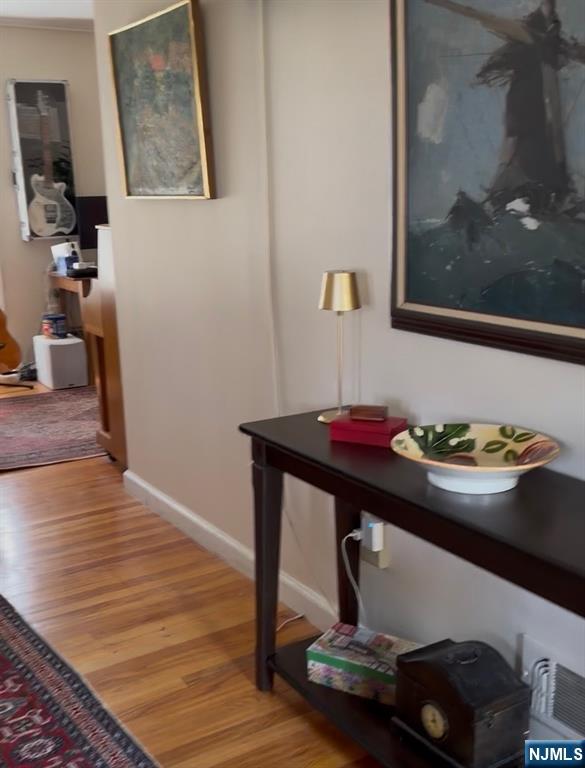 249 Madison Avenue Cresskill, NJ 07626 - Photo 16 of 26 a room with wooden floor and furniture