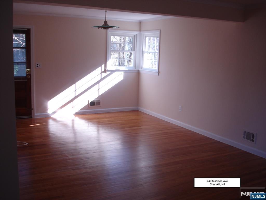 249 Madison Avenue Cresskill, NJ 07626 - Photo 20 of 26 a view of empty room with wooden floor and fan