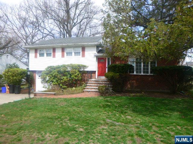 249 Madison Avenue Cresskill, NJ 07626 - Photo 2 of 26 front view of a house with a yard