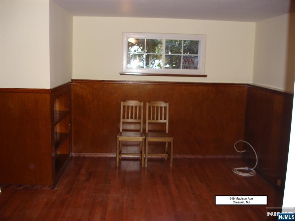 249 Madison Avenue Cresskill, NJ 07626 - Photo 22 of 26 wooden floor in a hall with a window