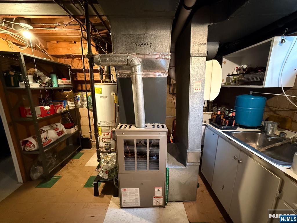 249 Madison Avenue Cresskill, NJ 07626 - Photo 26 of 26 a kitchen with a refrigerator and a stove