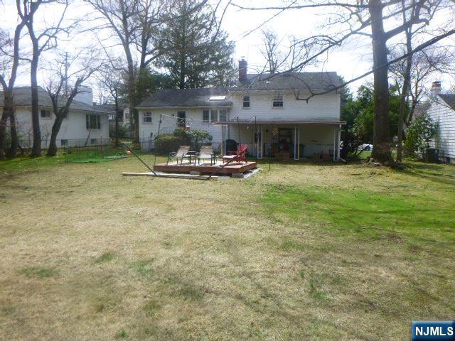 249 Madison Avenue Cresskill, NJ 07626 - Photo 4 of 26 a view of a house with backyard and sitting area