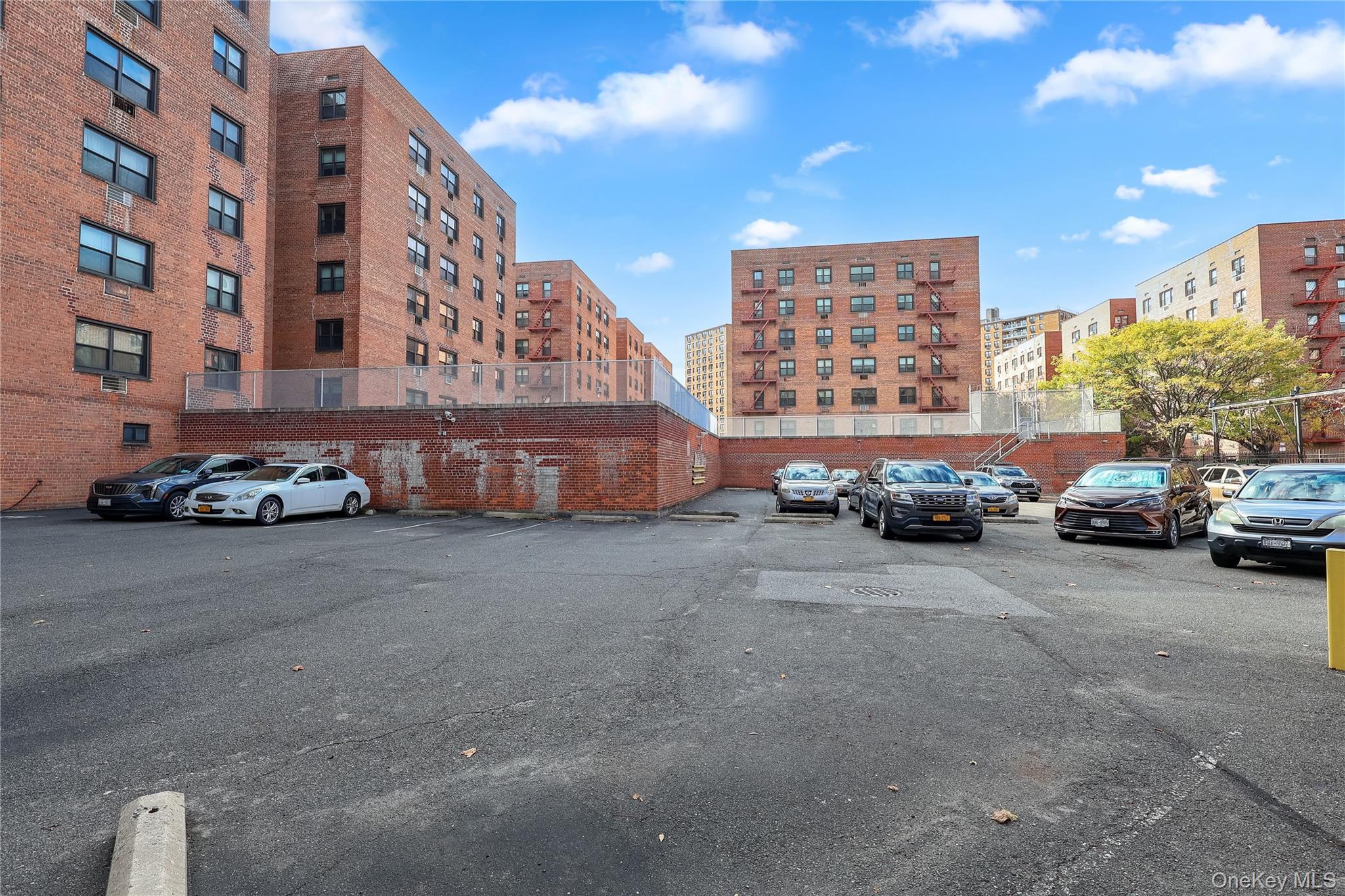 99-35 59th Avenue, Unit 4E Queens, NY 11368 - Photo 20 of 22 View of uncovered parking lot