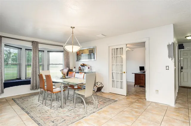 a kitchen with stainless steel appliances kitchen island granite countertop a stove and cabinets