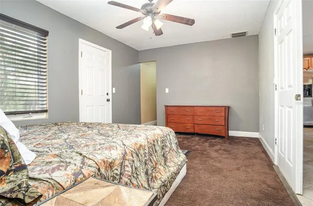 a spacious bathroom with a sink and a mirror