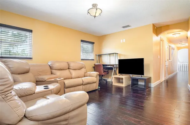 a kitchen with stainless steel appliances granite countertop a stove and a refrigerator