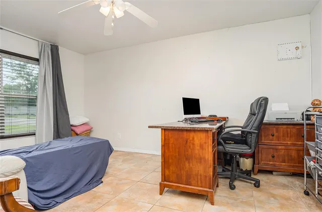 a spacious bedroom with a bed and a walk in closet
