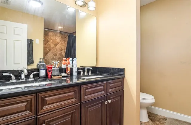 a view of a livingroom with furniture and staircase