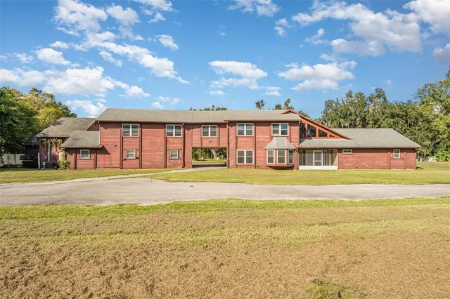 a living room with fireplace furniture and a flat screen tv